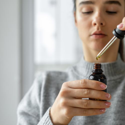 Woman taking CBD Oil - Best CBD for Anxiety