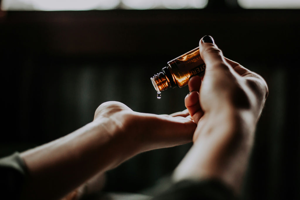 Person applies hemp seed oil product to skin